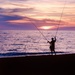 A fisherman with two poles by caterina