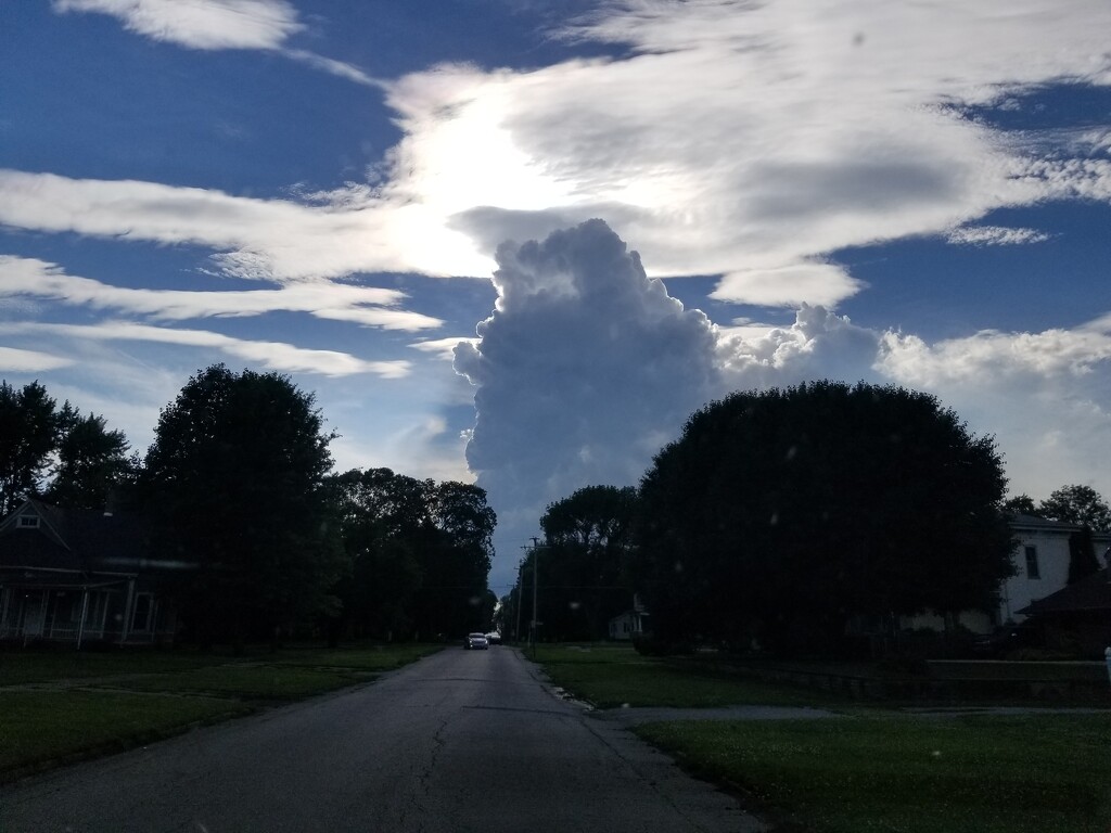Cloud monster coming down the street by scoobylou