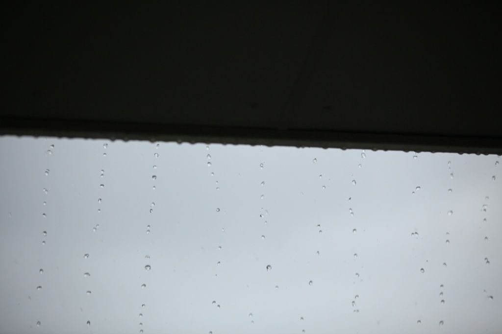 rain falling - from the roof over my balcony Christmas Island by lbmcshutter