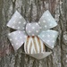 Ribbon bow on tree by acolyte