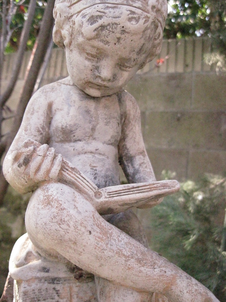 I've always had a fondness for this little statue in my yard by Weezilou