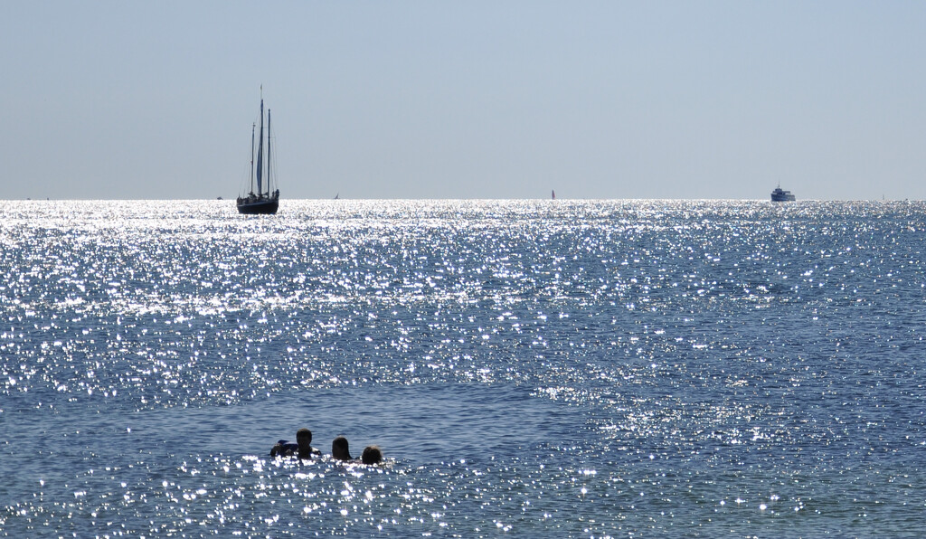 Swimmers and a Sailboat by radiodan