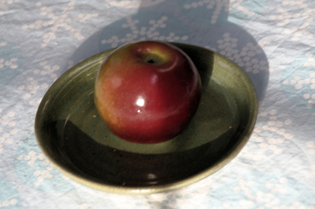 apple on dish by hjbenson