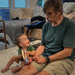 Pop-Pop reading to grandson by jbritt