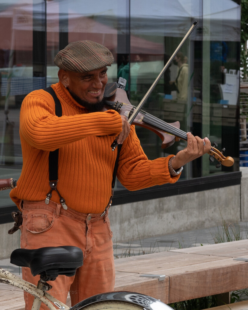Street Musician  by theredcamera