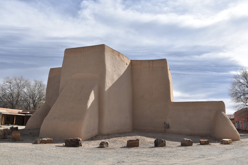 The San Francisco De Asis Catholic Church in Taos, New Mexico by louannwarren