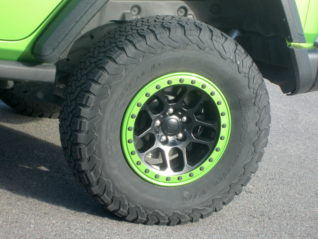 Fancy Tires On Lime-Colored Jeep by bjywamer