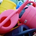Watering cans in glorious technicolour by dulciknit