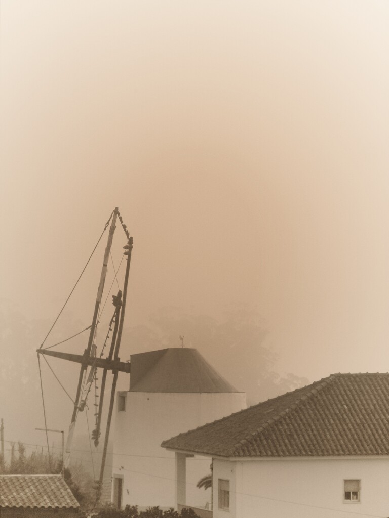 Sepia windmill with fog by antonios