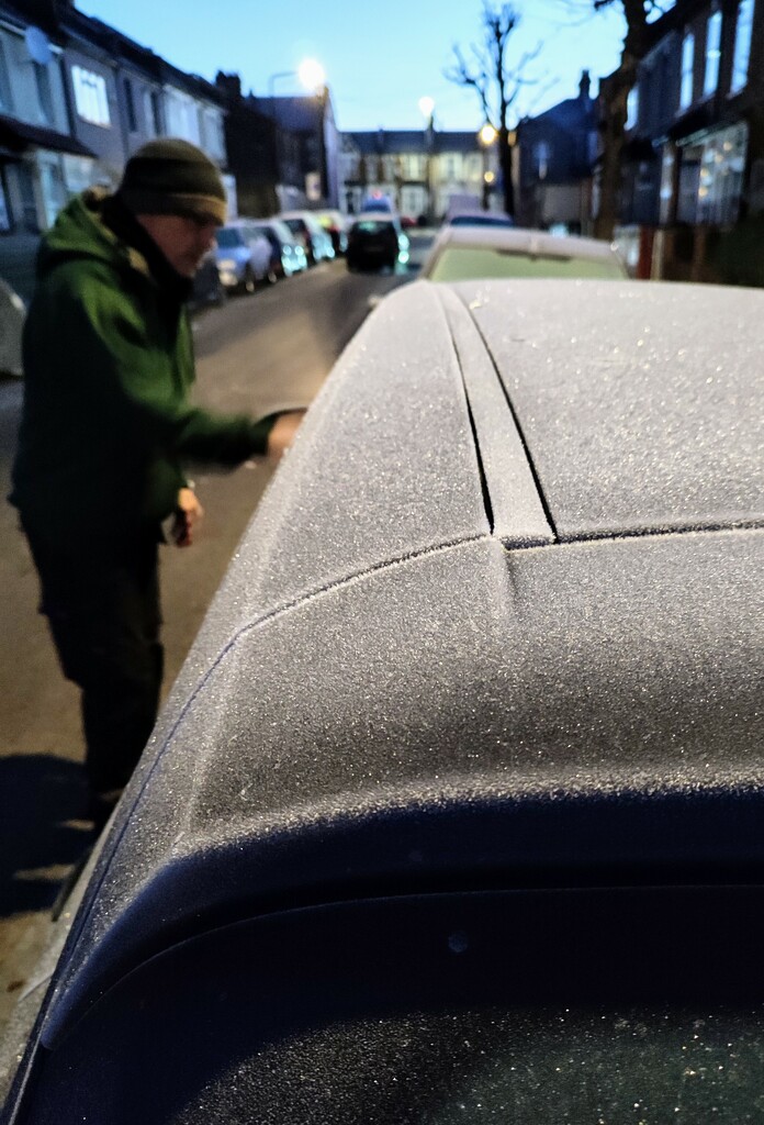 Scraping the ice off the car by boxplayer