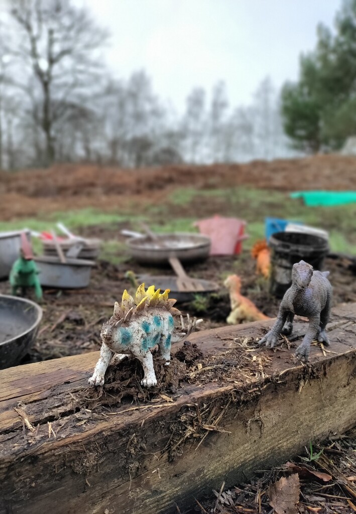 Dinosaurs in the mud kitchen by roachling