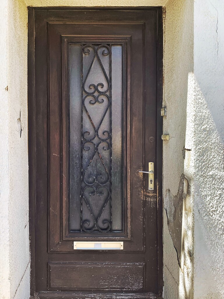 Four hearts on a brown door.  by cocobella