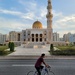 A cyclist at Masjid Al Zawawi by clearday