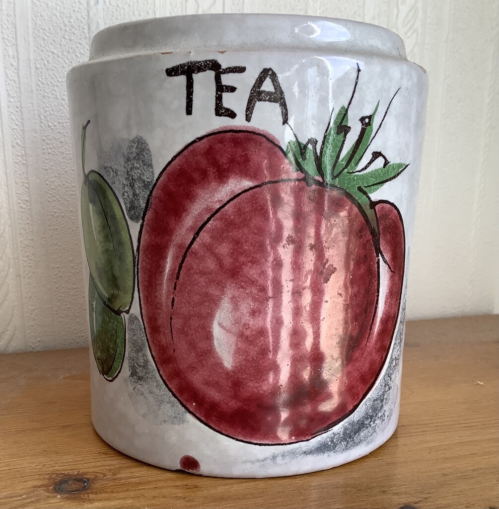 Red fruit on tea caddy by maggiej