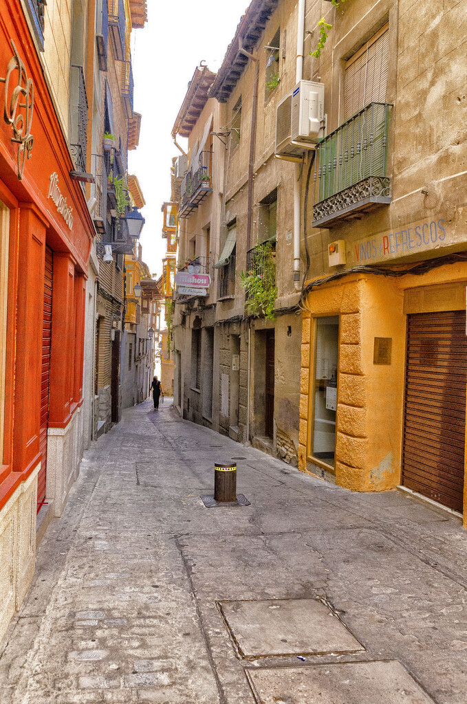 Colorful street in Toledo, Spain by ggshearron