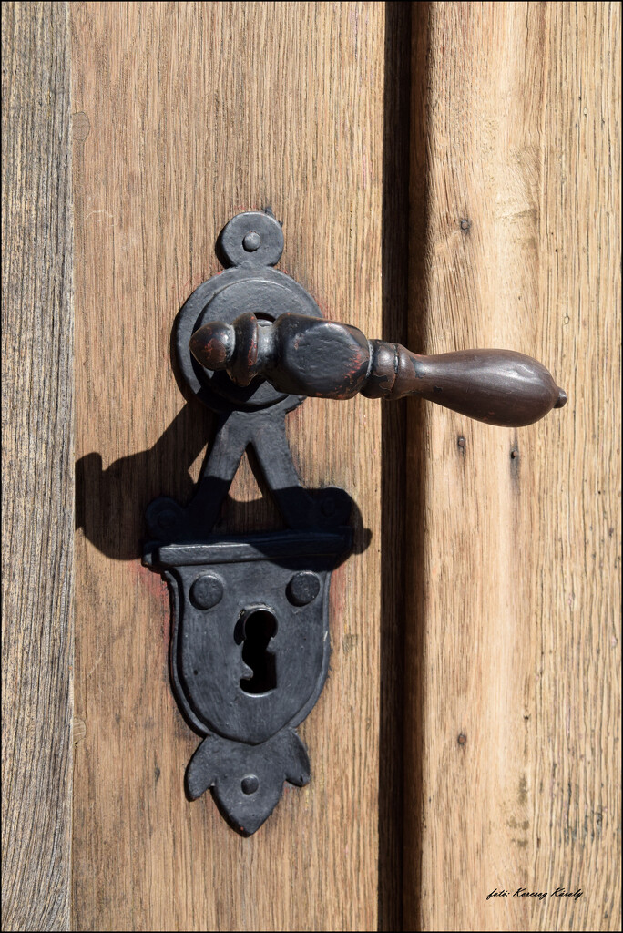 The handle of the gate of the closed church by kork
