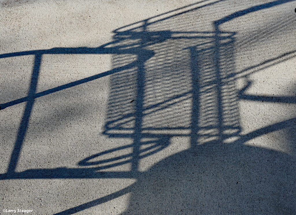 Shadow on the patio. by larrysphotos