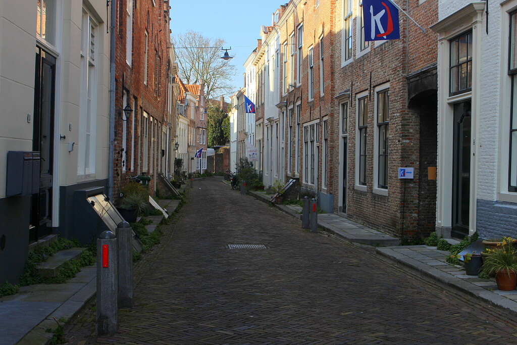 A street with an entrance to the alley`s by pyrrhula