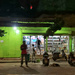Green shop at night.  by cocobella