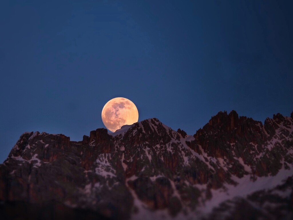 The Easter moon rising from Mount Sorapis  by caterina