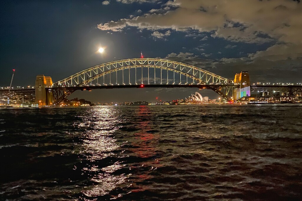 Full moon lighting up Sydney Harbour Bridge… by johnfalconer