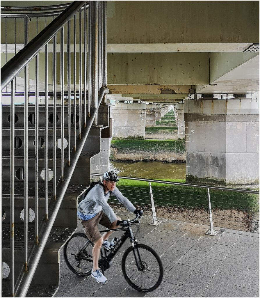 Cyclist under the Tay Road Bridge by sanderling