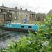 A canal narrowboat moored up near the Canal side Cafe. by grace55