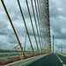 The lonely cyclist on a Normandie bridge by stimuloog