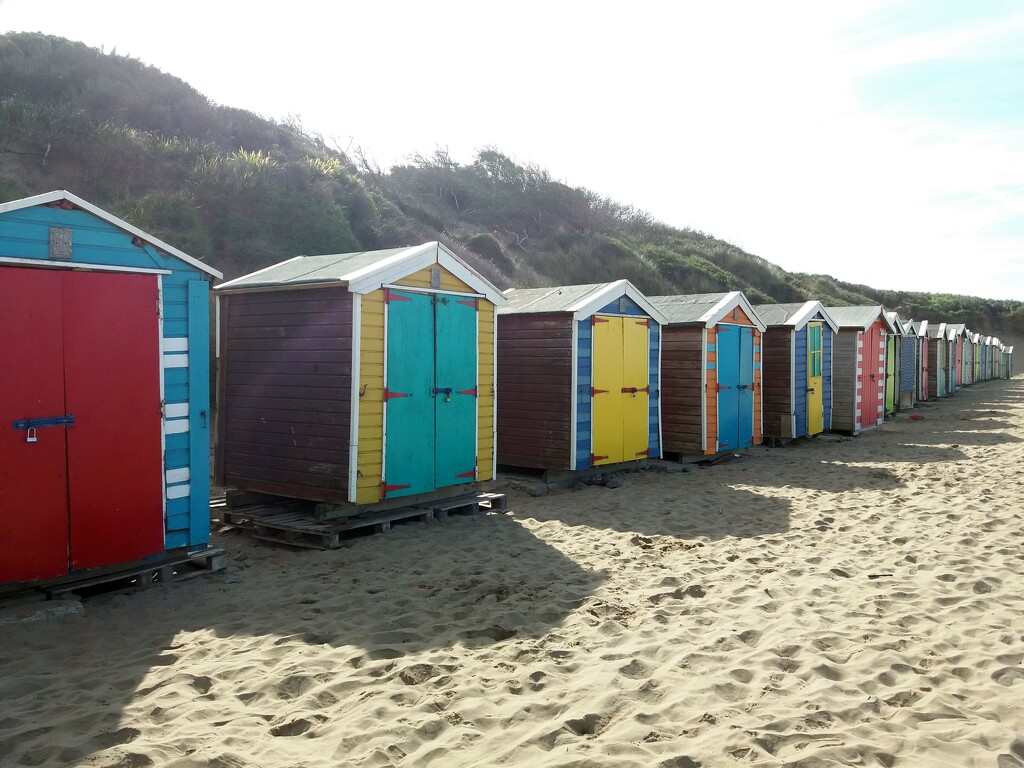 Beach huts on the beach by anitaw