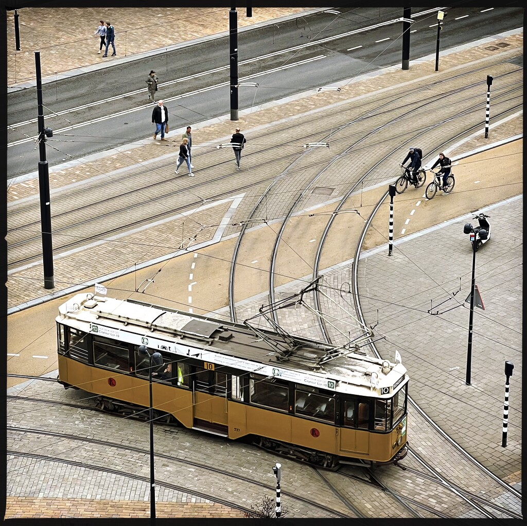 Poles, lines, curves, a few people and museum tram 10 by mastermek
