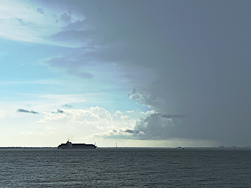 Ship entering Charleston Harbor after a storm by congaree