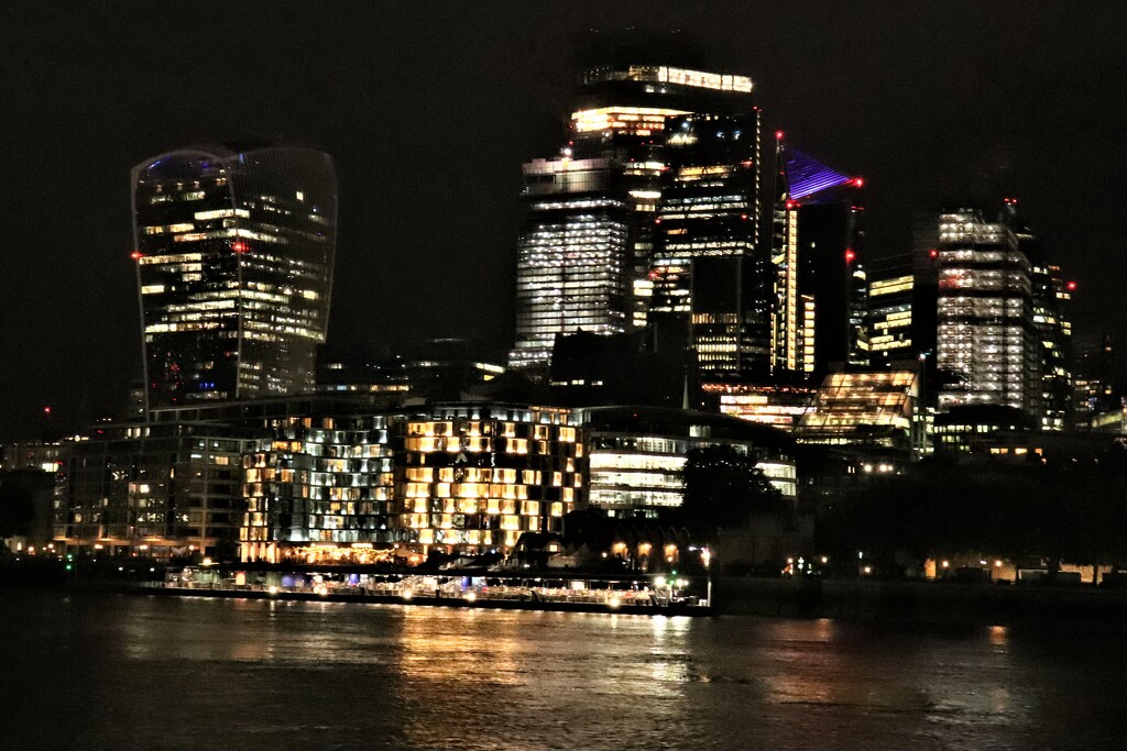 Across the Thames to the city at night. I don't know why no-one switches any lights off - dramatic as it looks by 365jgh