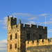 Alnwick Castle battlement figures in the last of the day's sun by anitaw