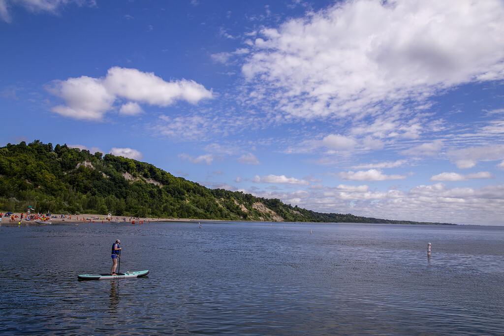 Paddle Surfing the Bluffs Beach by pdulis
