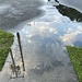 Cloud reflection in rain puddle 
