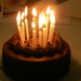 Mom's Birthday Cake with Candles Lit by sfeldphotos