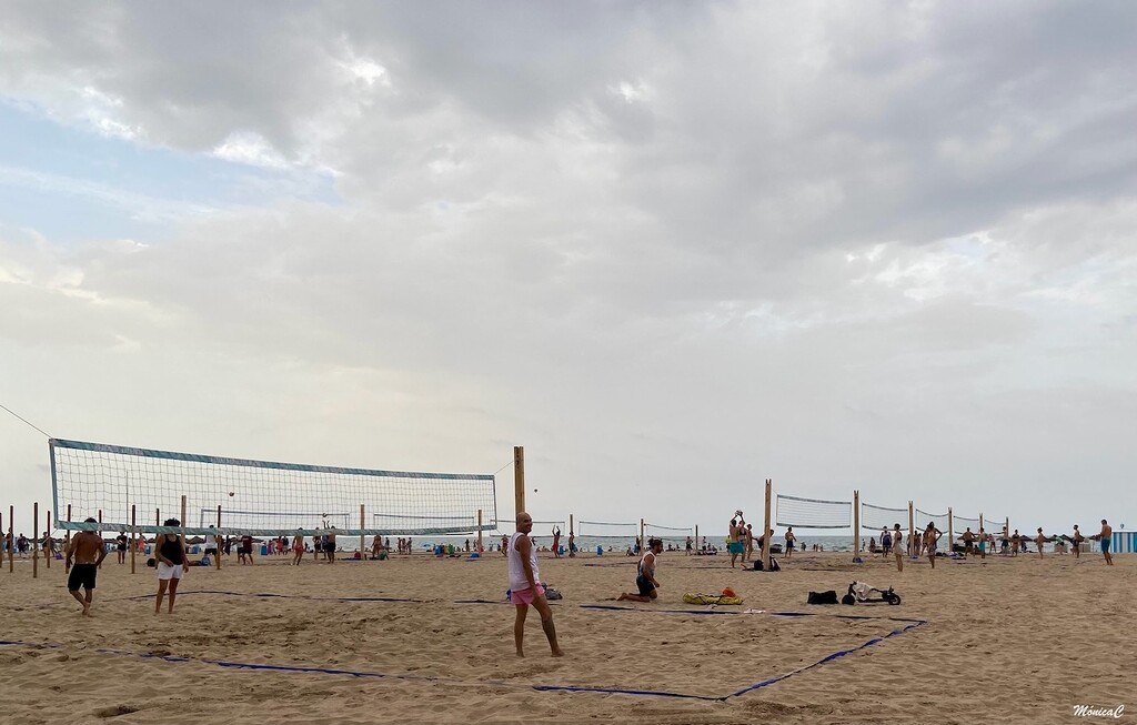 Volleyball on the beach by monicac
