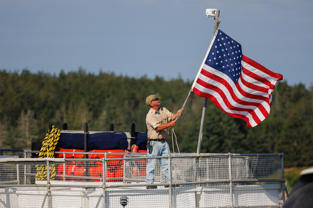 Raising the Flag on the Boat by jyokota