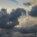 clouds over the eiffel tower by parisouailleurs