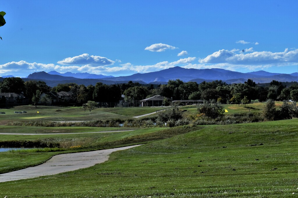 View of the Rockies from golf course, Loveland by sandlily