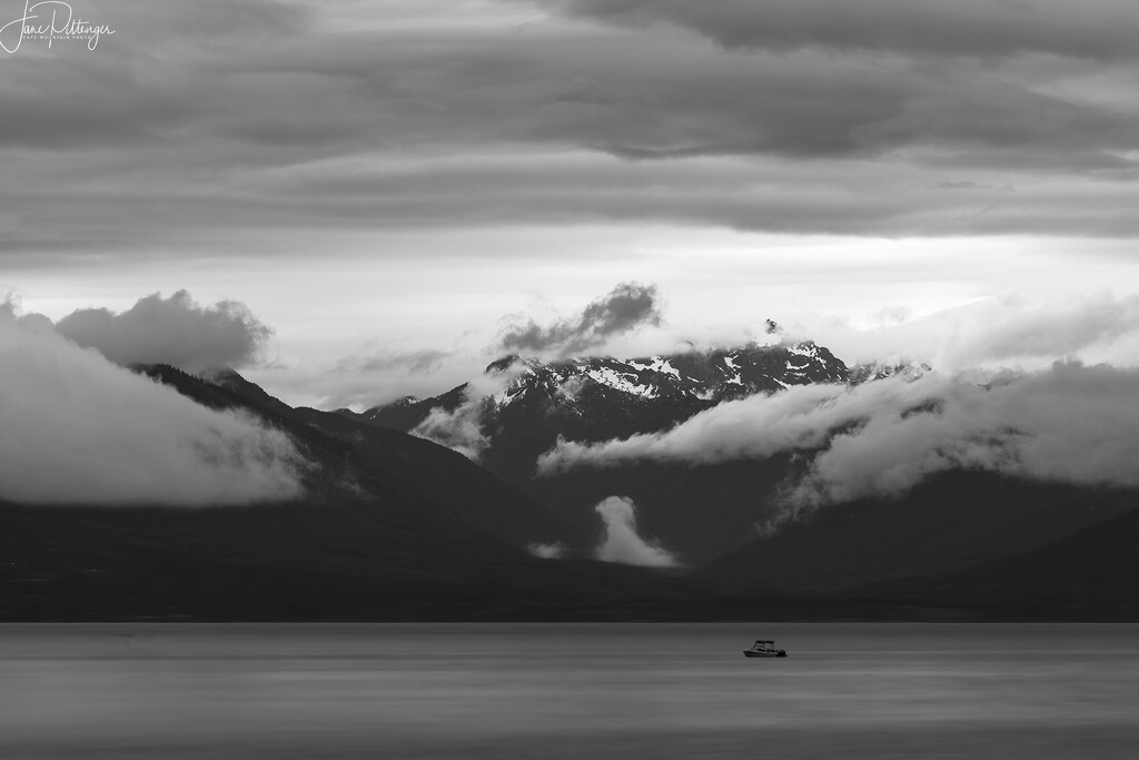 Boat and Olympic Mountains by jgpittenger