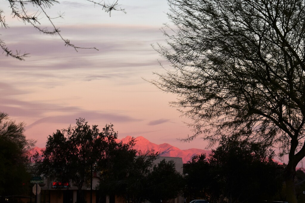 Sun setting sets the mountains alight  by sandlily