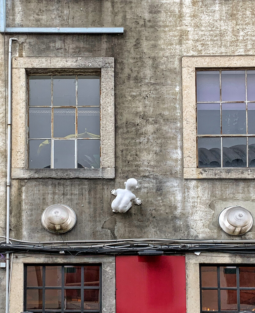 Scarring baby climbing the facade.  by cocobella