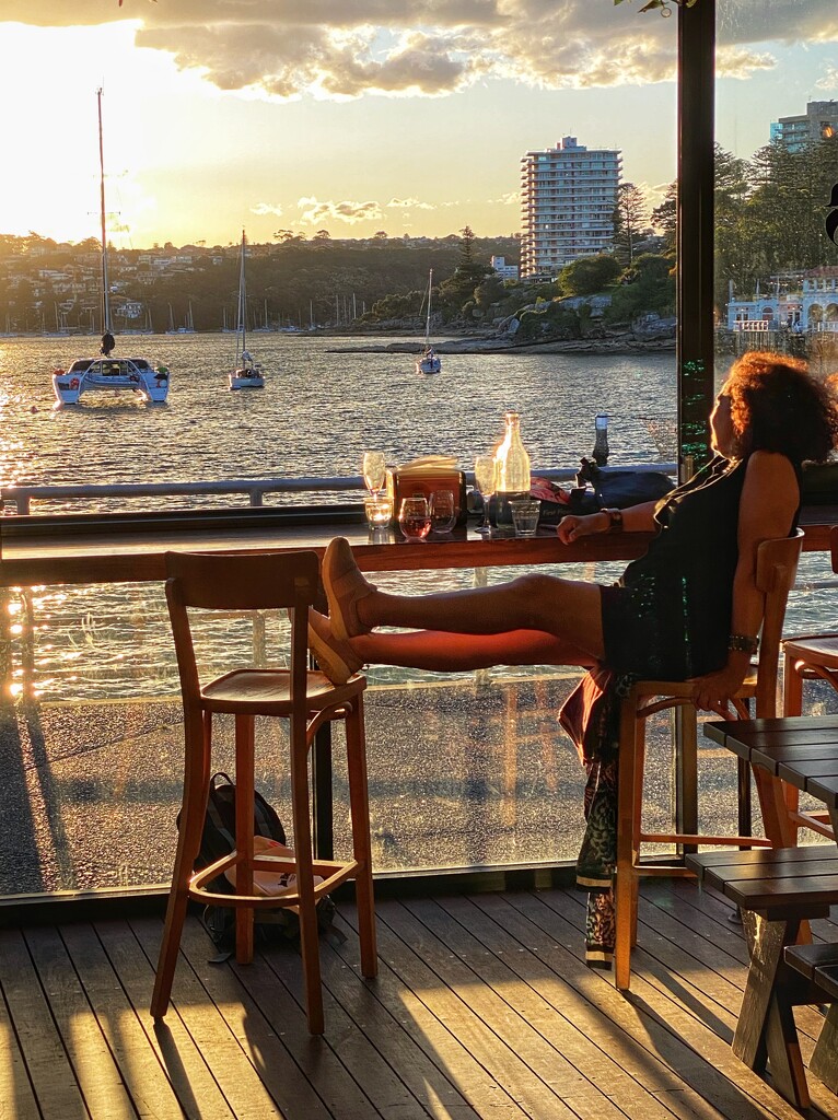 Sunset drinks at a local bar/restaurant in Manly. My friend looking after my seat.  by johnfalconer