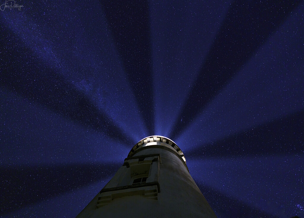 Looking At the Stars Through the Lighthouse Rays at Twilight by jgpittenger