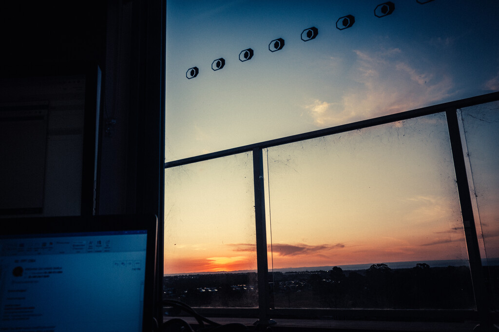 working from home while watching sunset by mumuzi
