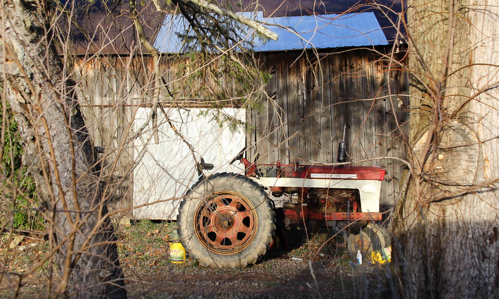Tractor by the barn by mittens