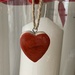 Red heart and a candle.  by cocobella