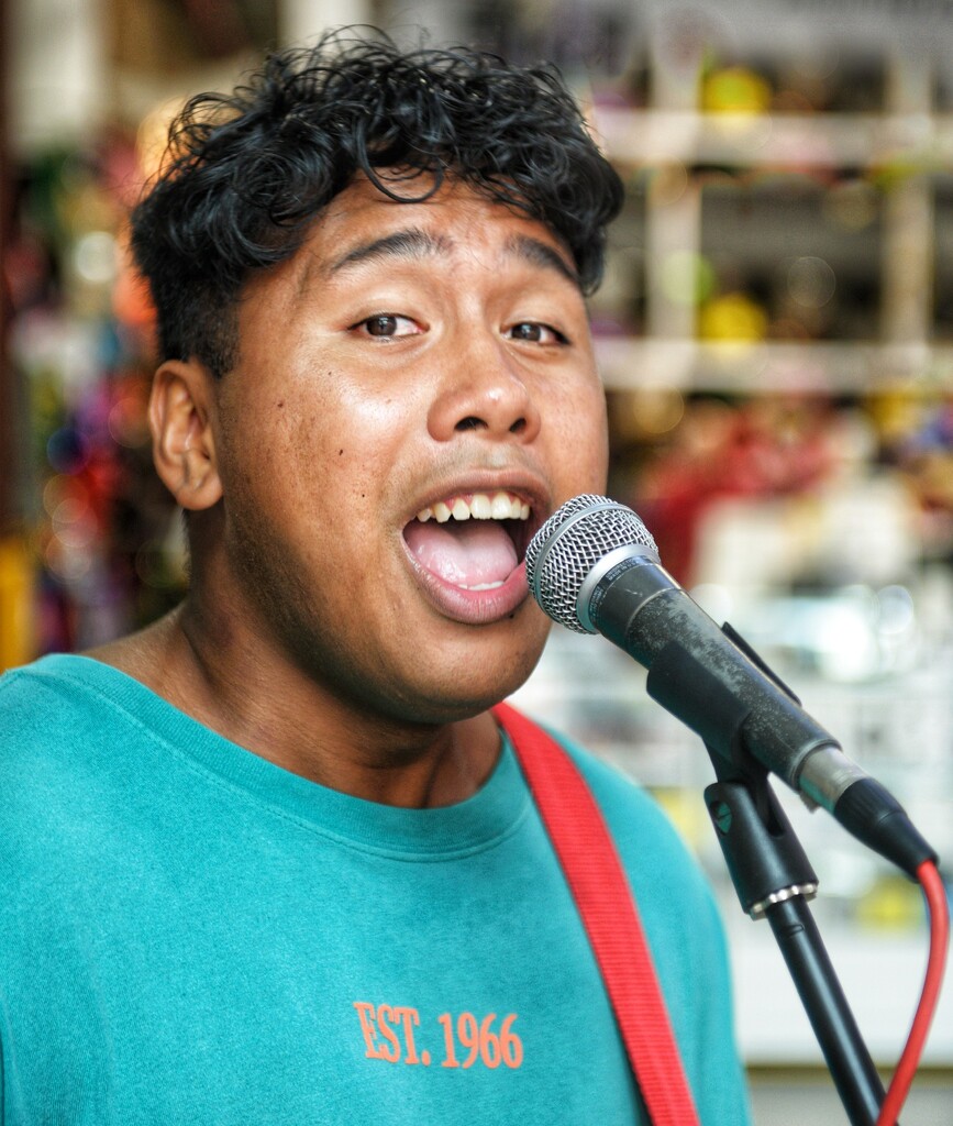Young singer Red Roy at the markets in Darling Harbour.  by johnfalconer