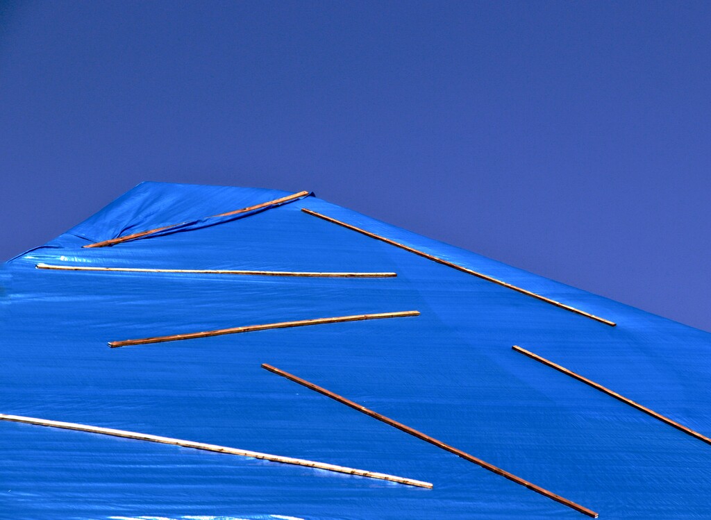 Reinforce plastic blue tarps by joemuli